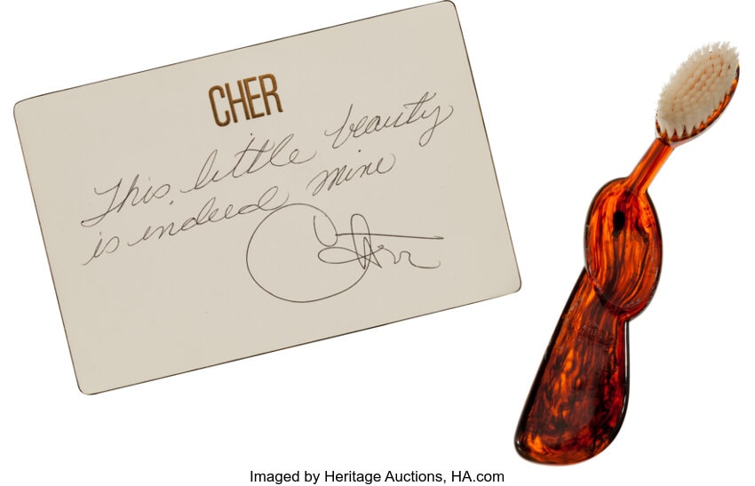 Cher's Radius toothbrush accompanied by her handwritten ownership note.