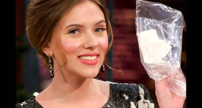 Scarlett Johansson with the tissue auctioned for charity after her 2008 appearance on The Tonight Show with Jay Leno.
