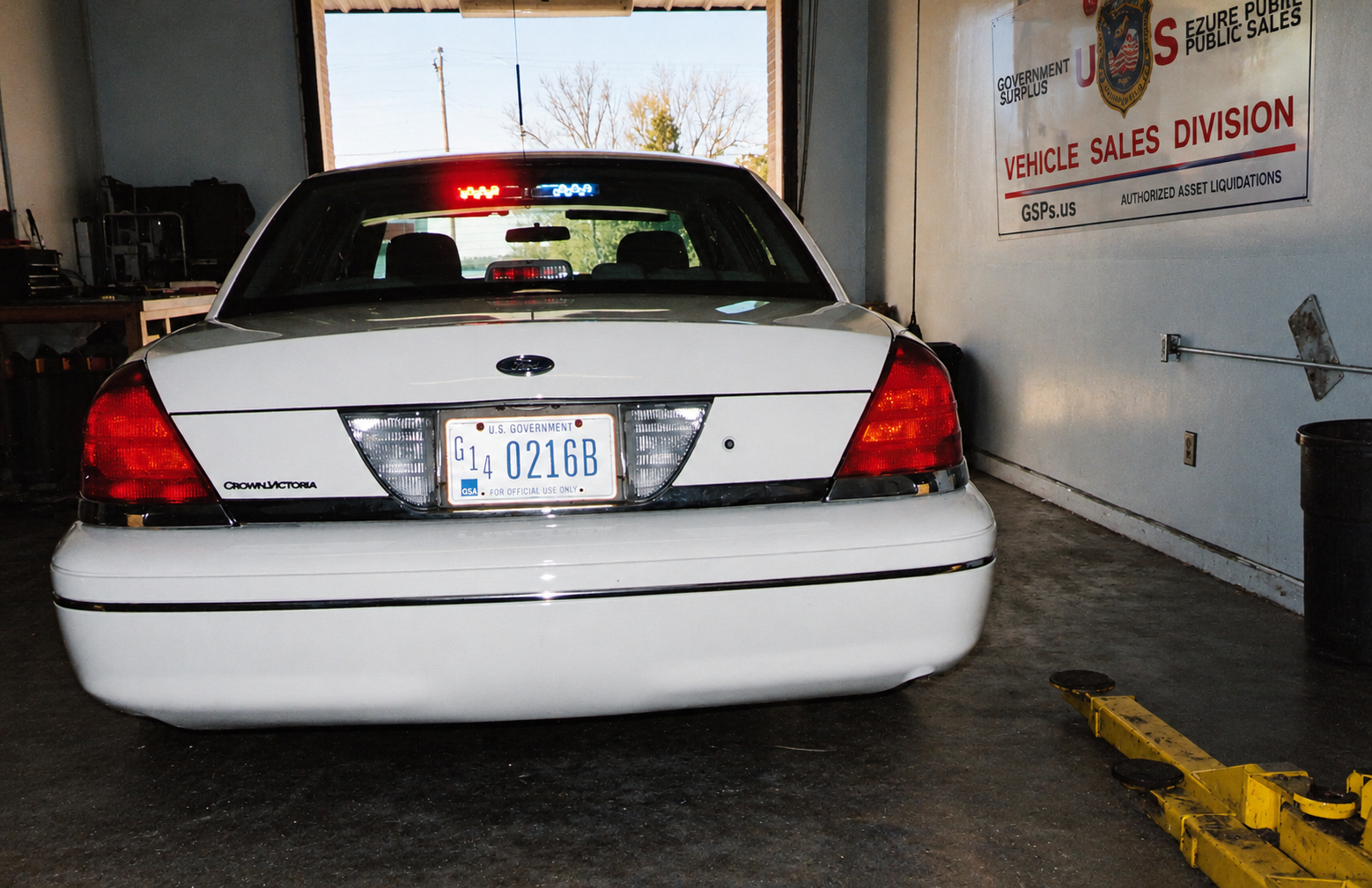 Rear view of a government fleet Crown Victoria inside the vehicle service facility circa 2002.