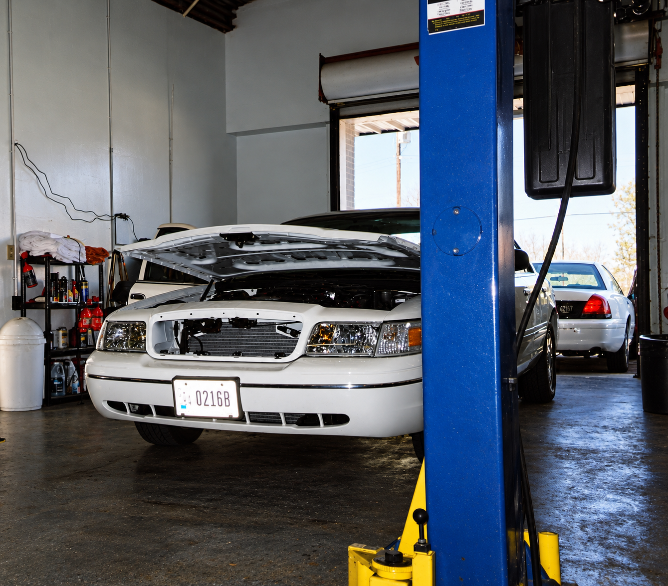 Government fleet vehicles undergoing service and equipment removal circa 2002.