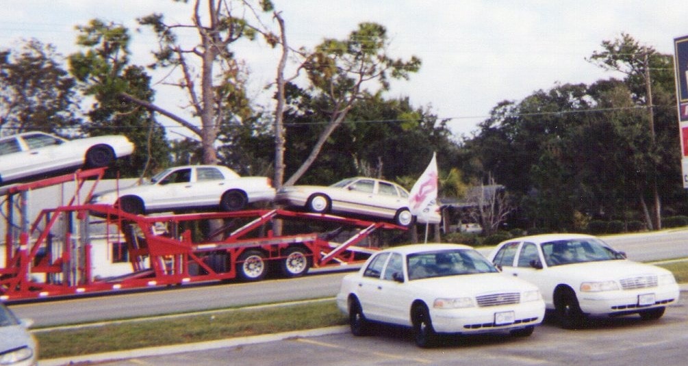 Government fleet Crown Victorias being transported during fleet operations.