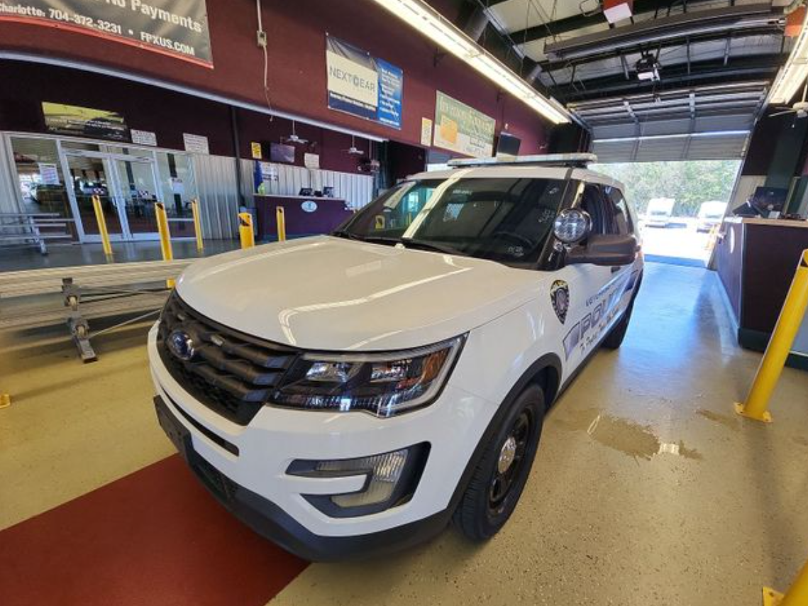 Marked government law-enforcement Ford Explorer photographed at a public vehicle auction
