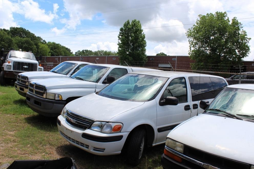 Trucks, vans and other government vehicles awaiting their next use through South Carolina surplus system