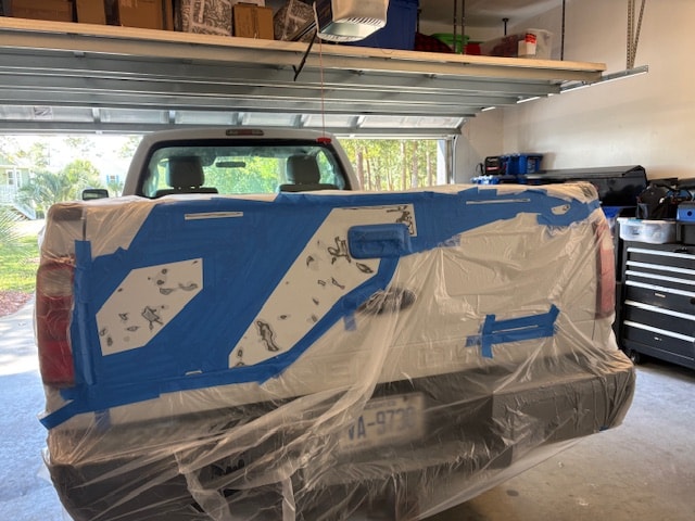 Ford F-350 tailgate masked and sanded before painting