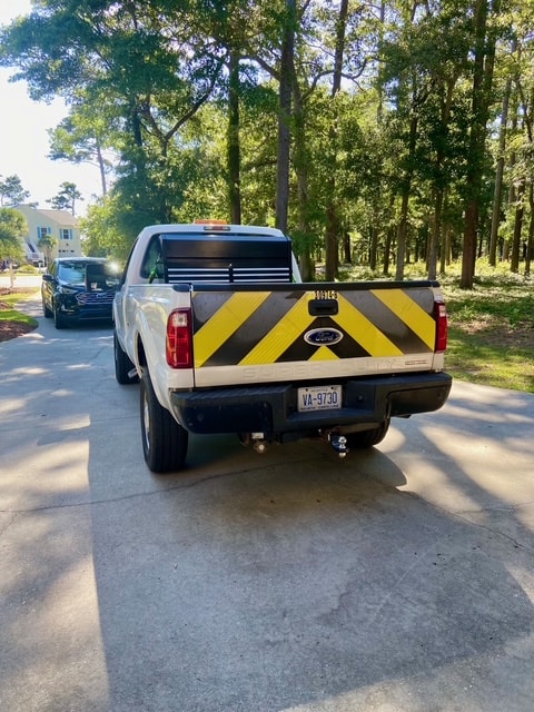 Ford F-350 rear view showing original black-and-yellow highway markings