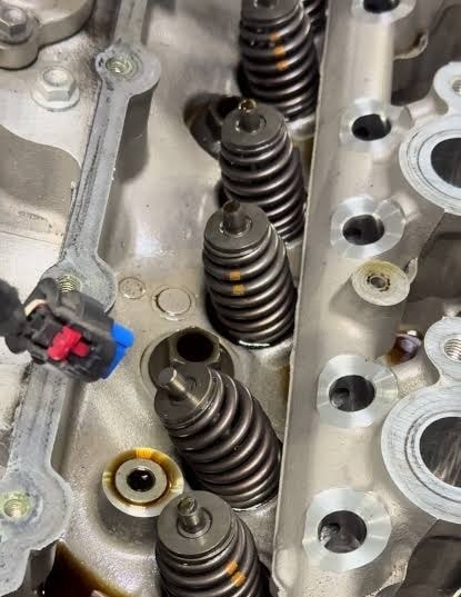 Chevrolet 5.3L cylinder head with valve springs exposed during engine disassembly