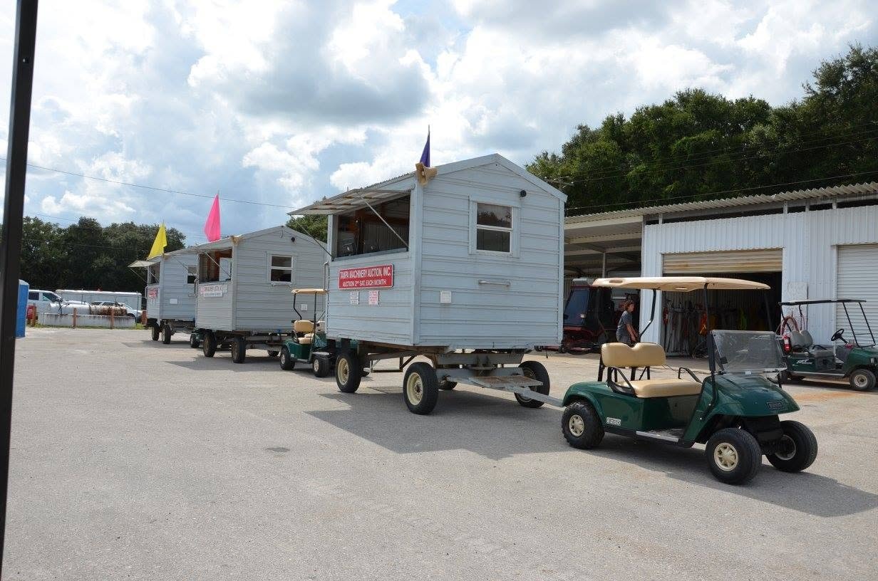Auction sheds lined up at Tampa Machinery Works before online auctions became standard