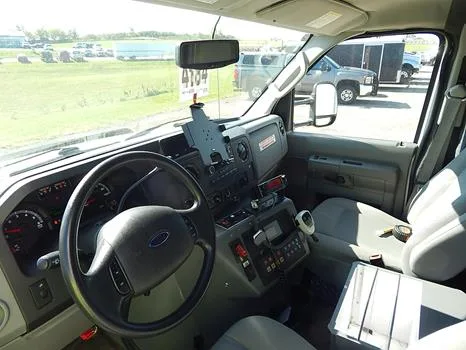 The Ford grille, the driver's cab and the rear doors opening onto the patient compartment.