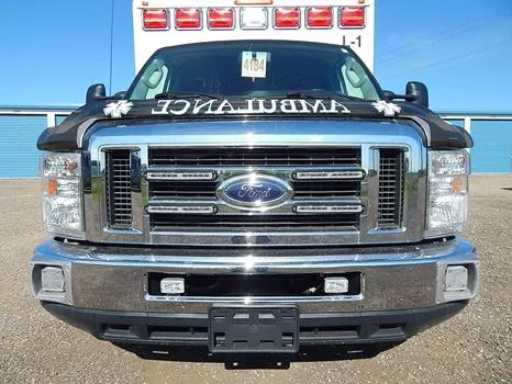 The Ford grille, the driver's cab and the rear doors opening onto the patient compartment.