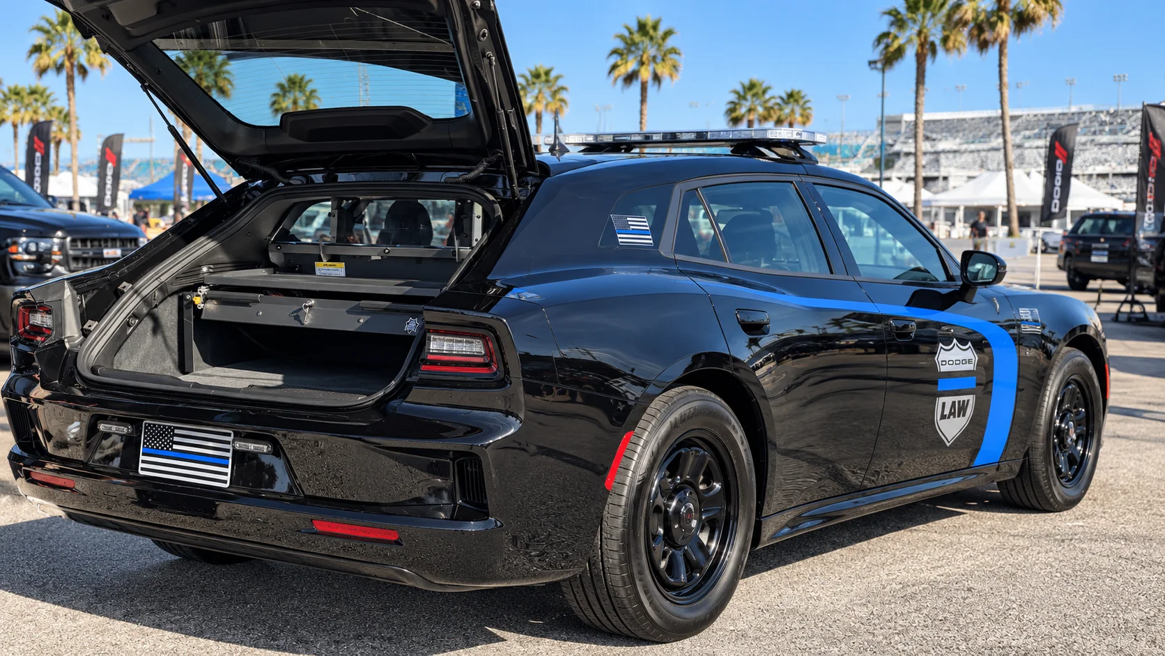 AI-generated illustration of the 2027 Dodge Charger police car with its rear hatch open, showing the cargo tray