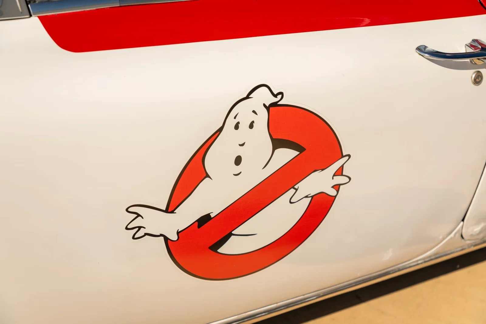 The red and white no-ghost logo on the door of an Ectomobile re-creation