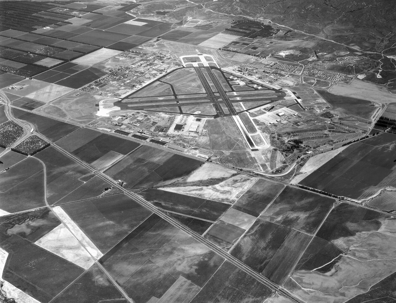 Black-and-white aerial view of MCAS El Toro surrounded by farmland in 1962