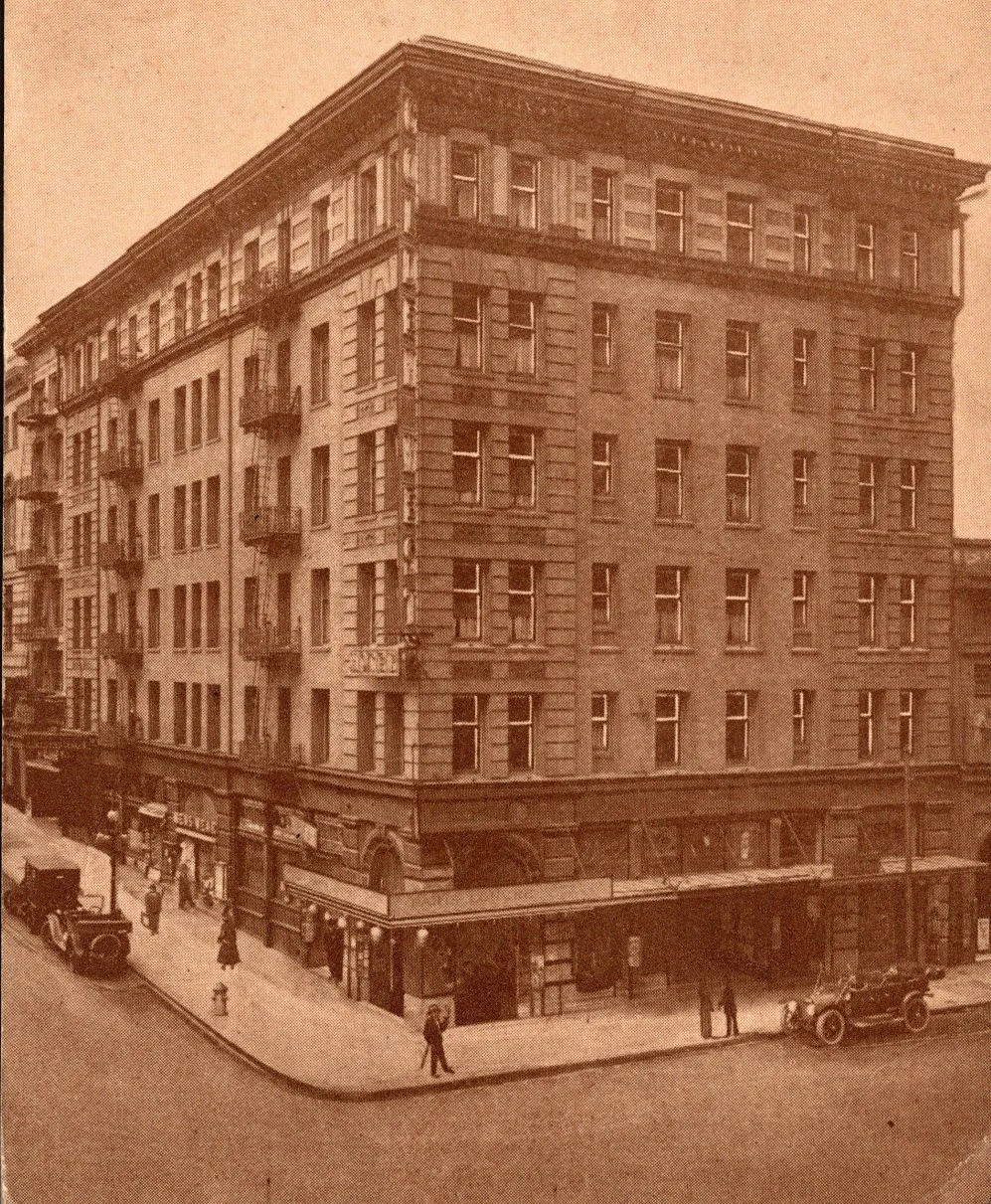 A vintage photo of the Golden West Hotel at the corner of Ellis and Powell in San Francisco, with early automobiles on the street