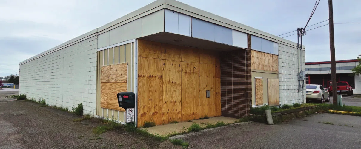 Summerfield, Florida; the Evergreen office condo in Springfield, Missouri; and the boarded service building on Division Avenue in Grand Rapids. Photos: U.S. Department of the Treasury auction listings.