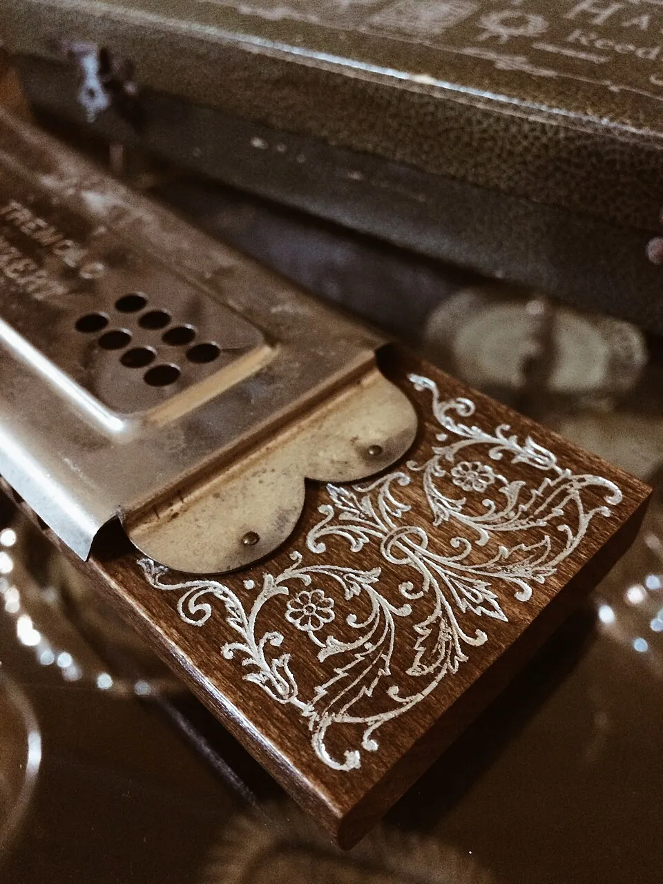 Antique wheelchairs, a violin, a harmonica, a convex mirror and other pieces from the asylum's collection.