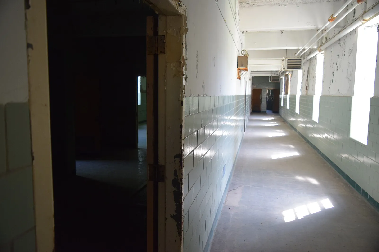 Visitors explore the empty wards on tour.