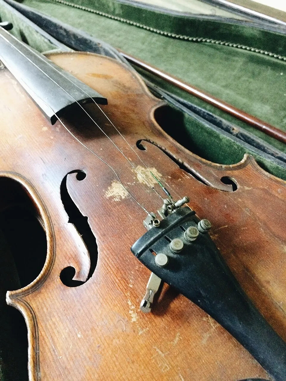 Antique wheelchairs, a violin, a harmonica, a convex mirror and other pieces from the asylum's collection.
